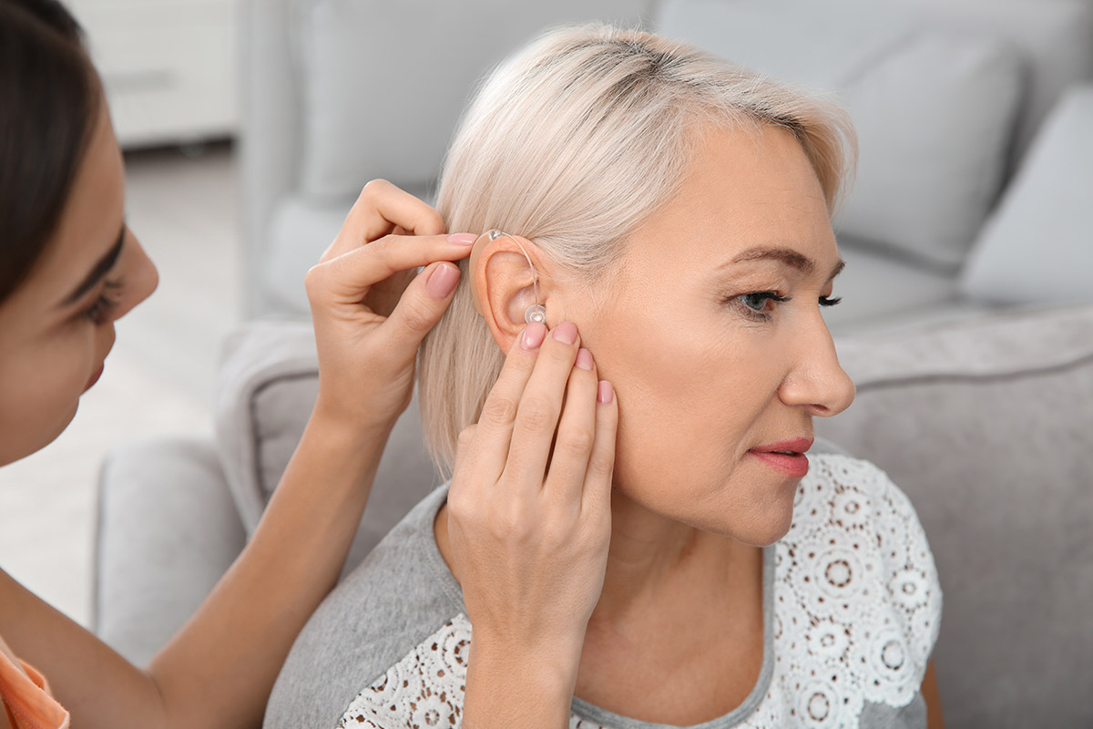 Audiologist Fitting Hearing Aid